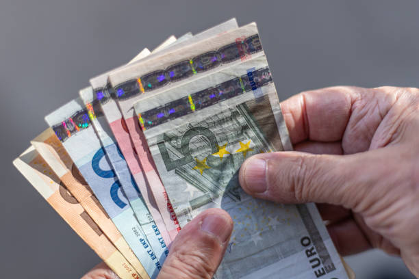 A fan of Euros in hand