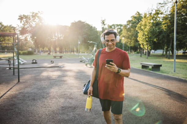 Young active man resting after training in the park