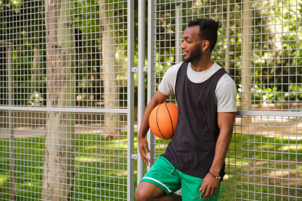 istock Young basketball player relaxing after training outdoors 2160238657