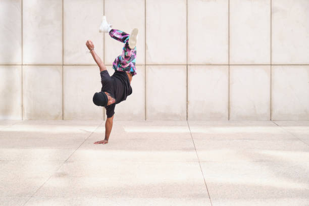 istock Young man practicing breakdance moves outdoors in urban environment 2160240865