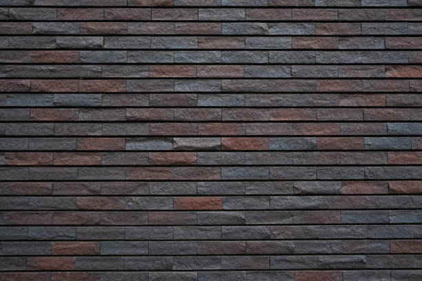 istock Section of a brown and gray rock tiled wall 2160241214