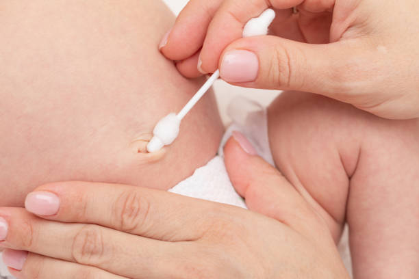 istock Mother Wipes Newborn Babys Navel 2160243125