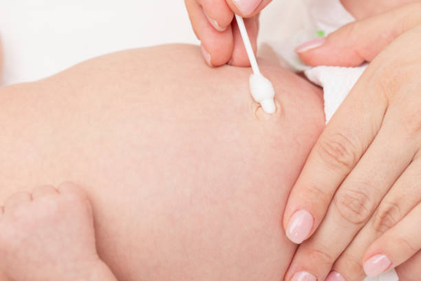 istock Mother Cleaning Newborn Babys Navel 2160243197