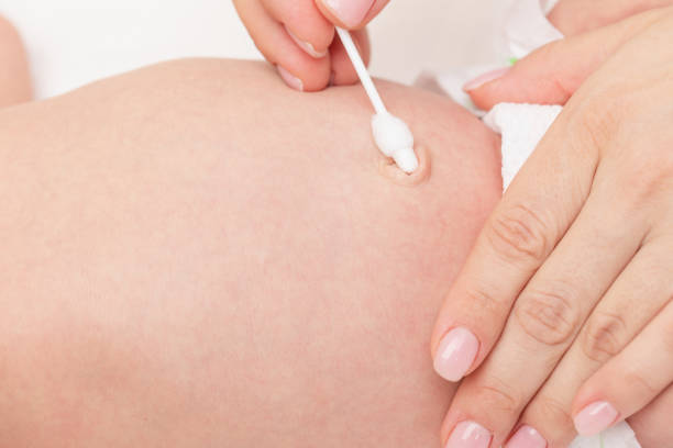 istock Mother Wipes Newborn Babys Navel 2160243214