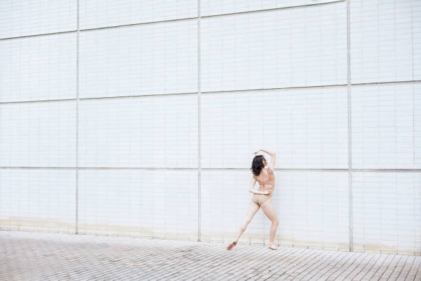 istock Young ballerina in ballet pose 2160244896