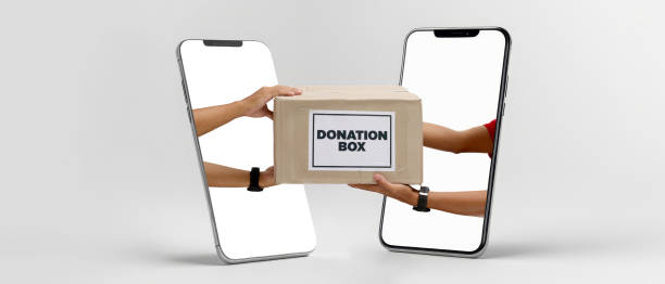 istock Hands Holding Donation Box from Smartphones - Digital Volunteering Concept 2160246924