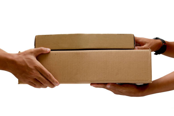 istock Hand Holding Brown Paper Box Package Isolated on White Background 2160248896