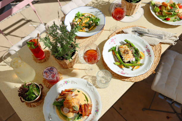 istock Serving Gourmet Dinner at Sunny Restaurant Terrace 2160248932