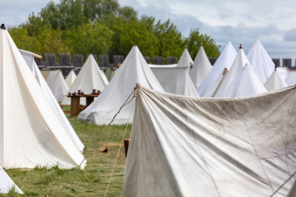White medieval tents in nature in summer.