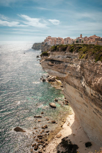 The citadel of Bonifacio in Corsica where houses are perched above the Mediterranean sea on limestone cliffs which have been undercut by the sea and weather