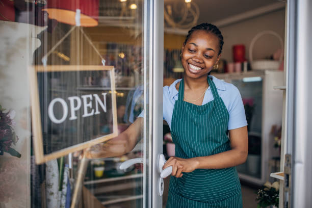 istock Young florist opening a flower shop 2160252596