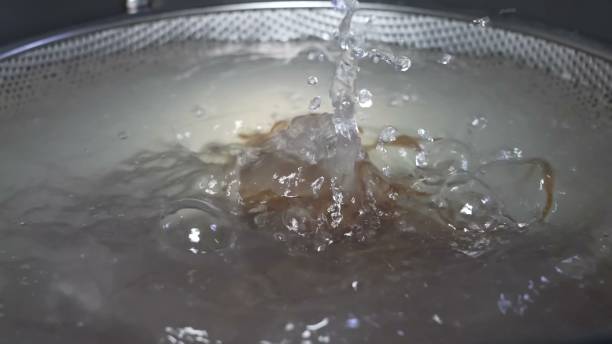 istock Soba noodles boiling in water inside a metal sieve 2160252725