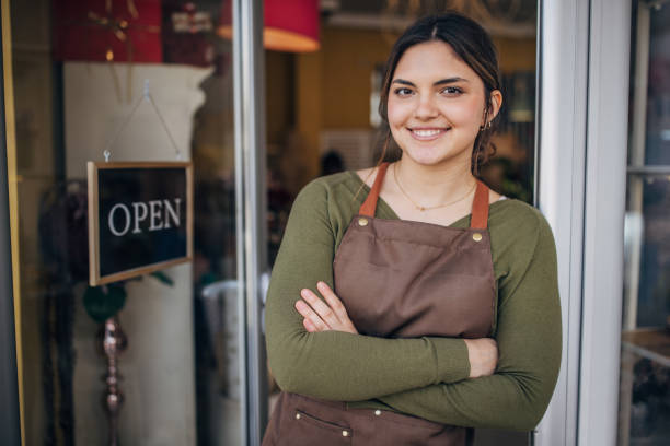 istock Young florist standing confidently with arms crossed 2160252794
