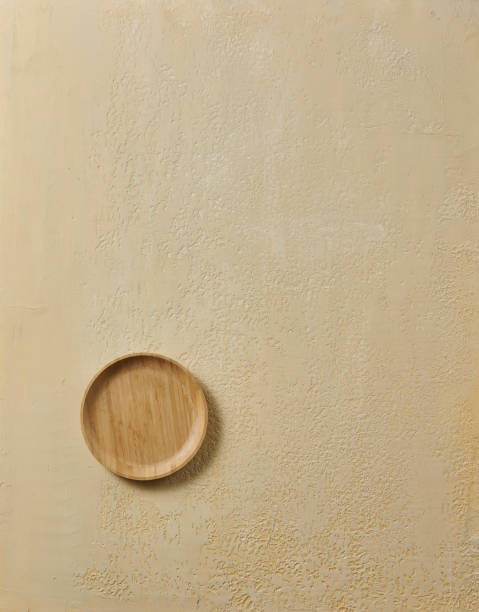 istock Wood plate on the textured background table style. 2160254237