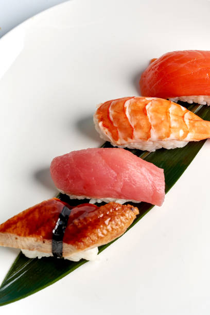 istock Sushi with tuna, salmon, shrimp and eel on a plate 2160254728