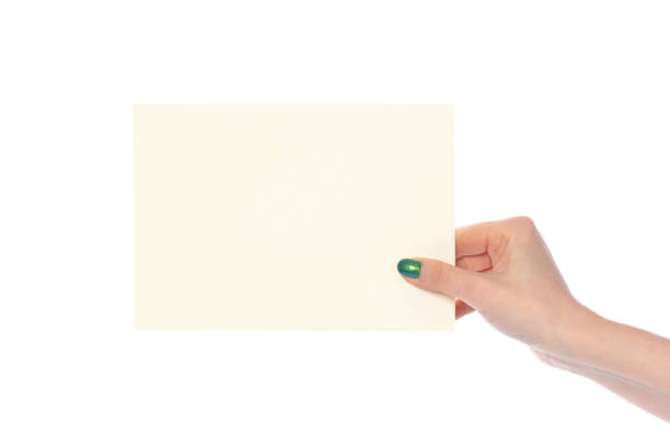 istock Woman's hand showing white paper banner isolated on white 2160255552