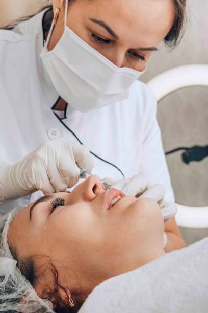 istock professional aesthetician performs a meticulous skin treatment 2160259285