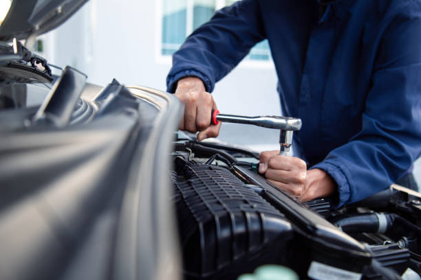 istock Professional mechanic working on the engine , repairing a car engine automotive workshop with a wrench, car service and maintenance,Repair service. 2160261699