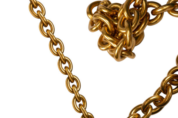 Overhead shot of defocused stacked long silver chain texture background.