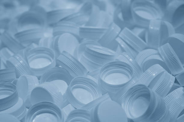 istock The group of plastic bottle caps in the light blue scene. 2160264040