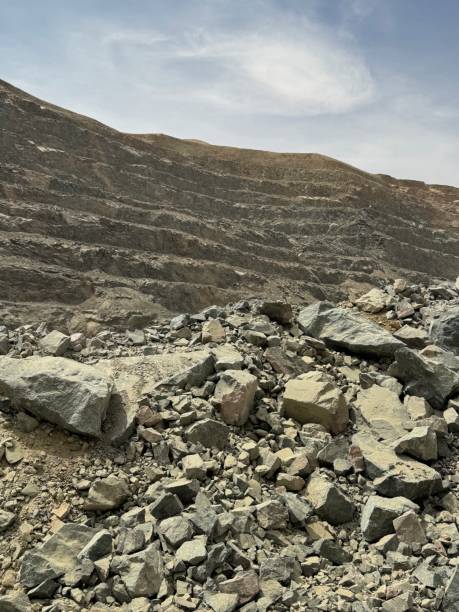istock Largest Open pit gold mines in saudi arabia, Extracting Ore from the earth with the help of heavy machinery 2160270458
