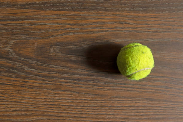 tennis ball on dark tone with copy space