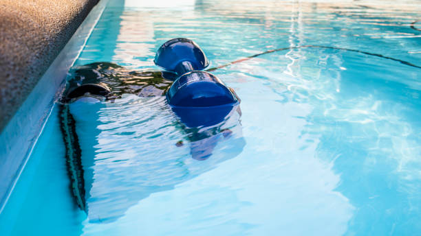 istock The pool robot cleans the pool in summer. Pool maintenance concept, copy space 2160273531