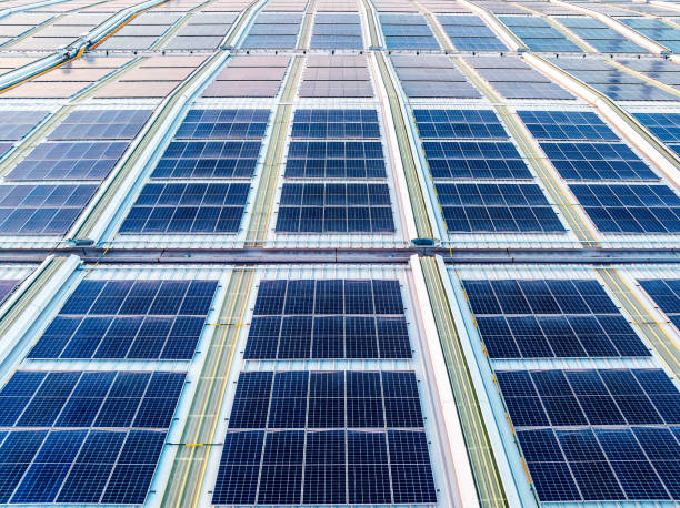 istock Solar panels on factory roof 2160273855