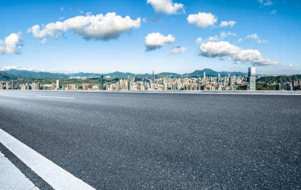 istock Empty asphalt road and cityscape in modern city 2160274122