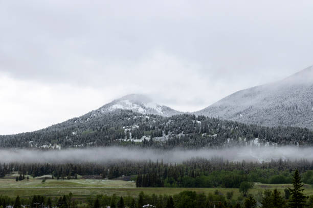 Free Stock Photo of Dark clouds over snowy mountain peaks and valleys ...