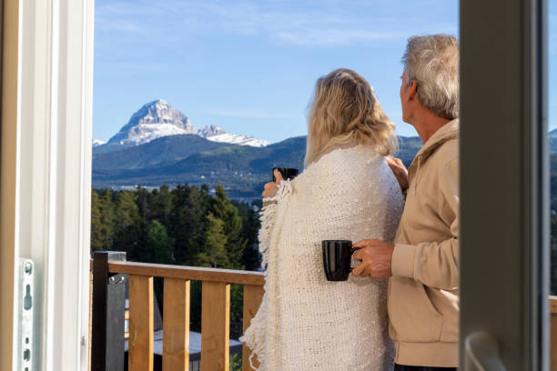 istock Senior couple relax on verandah with hot beverage 2160274845