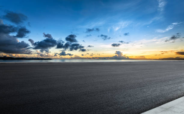 istock Empty asphalt road and cloudscape by the sea 2160274920