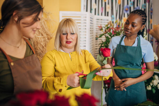 istock Flower arranging workshop with florist and students 2160274938