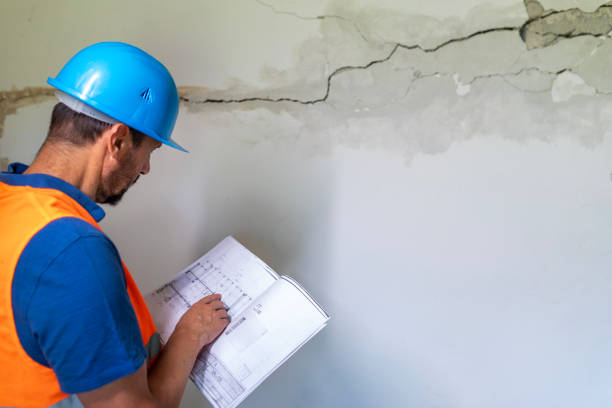 istock Real estate property appraisal engineer studying the blueprints. 2160275273