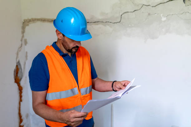 istock Real estate property appraisal engineer studying the blueprints. 2160275313