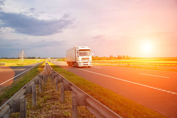 istock A white modern truck with an isothermal refrigerated semi-trailer transports perishable products in a trailer with a constant temperature regime. Transportation of seafood, fruits and meat. Copy space for text, sunset 2160275885