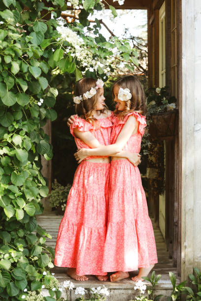 istock Twin Girls in Garden 2160276303