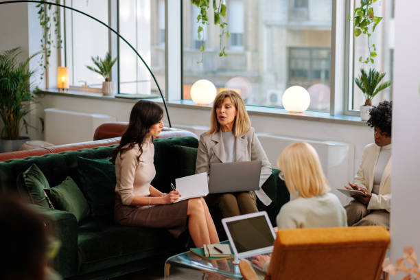 istock Journalist interviewing a woman's business team 2160276452