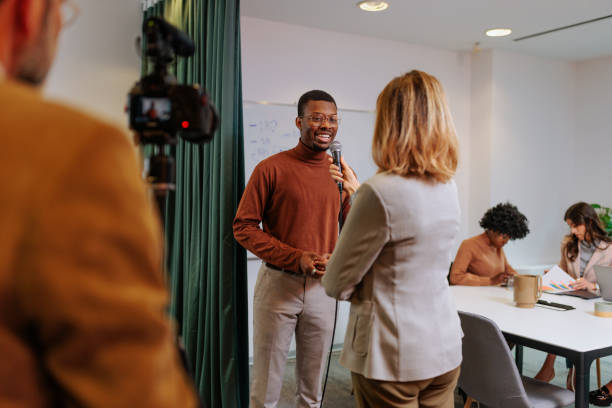 istock Businessman gives interview to a TV crew 2160276498