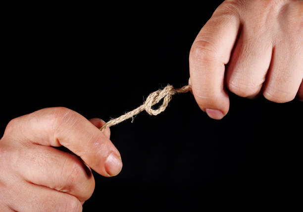 istock hands of the man on black background 2160279237