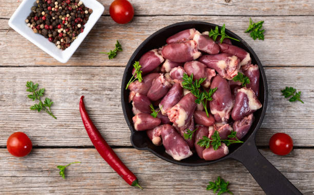 istock Raw chicken giblets hearts , meat background 2160279751