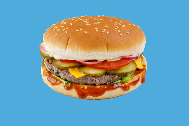 istock hamburger like in McDonald's with a beef cutlet on a blue background, studio shooting 2 2160280446
