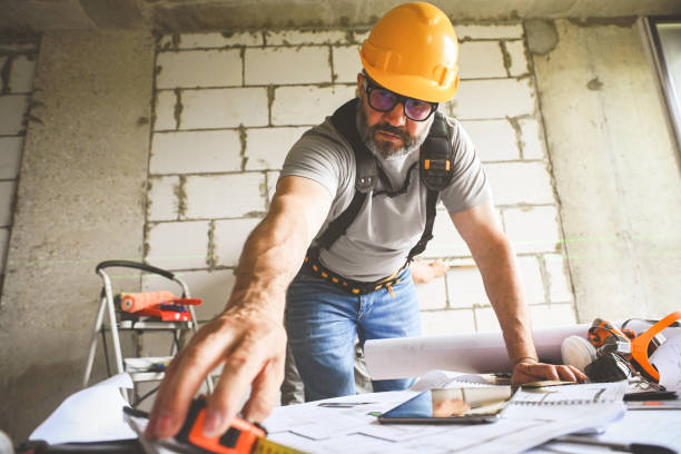 worker doing renovations in an apartment