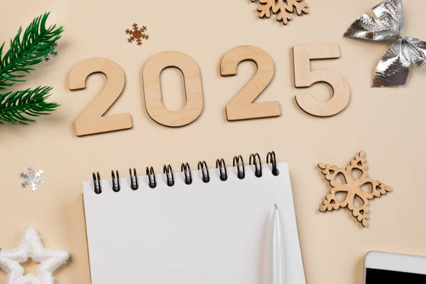istock New Year Aims 2025. To Do List. Empty Notebook at the Desk with Decorative House Model. Top view. Creating Plan, Resolution. New Life, Start Up, Beginning. Business ideas. Goals, action, checklist 2160280969