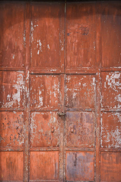 istock Weathered rusty metal door in Italy 2160281843