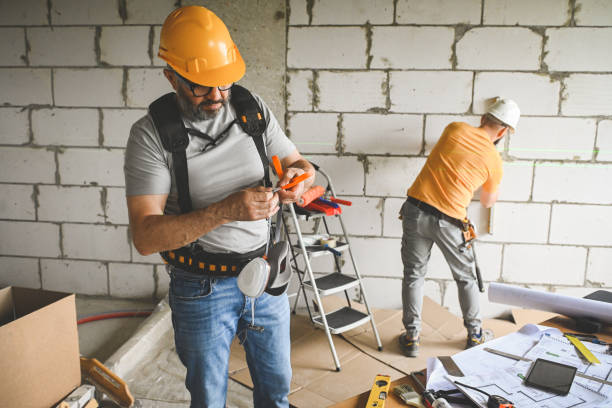 istock workers are doing repairs in the apartment 2160282318