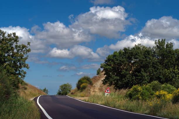 istock mountain road against the sky with clouds 2160284013