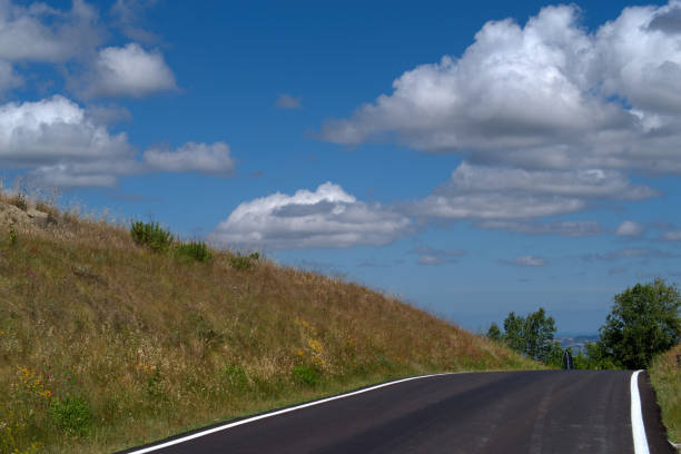 istock mountain road against the sky with clouds 2160285261