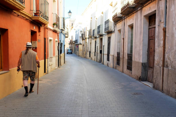 istock Tourist walking through a cute Spanish town 2160285340