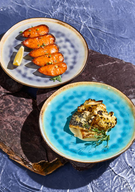 istock Gourmet Fish and Seafood Dishes on Elegant Plates 2160286910